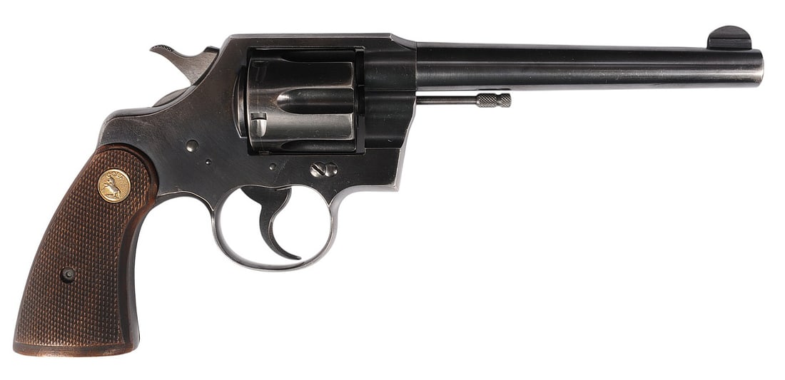 Colt Official Police Heavy Barrel .38 SPL Revolver FFL Required: 687658 (S4C1): A Colt Official Police Heavy Barrel .38 SPL Revolver that is in good to very good condition with a bright and defined bore. The action appears to function properly with a tight lockup, and the finish 