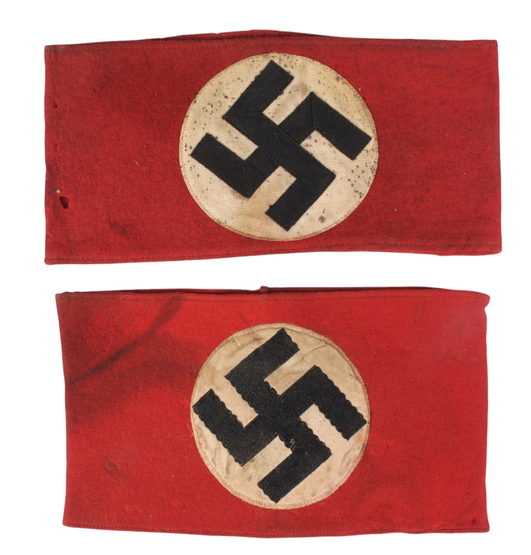 *German WWII Nazi Armbands Lot of 2(B3A): A *German WWII Nazi Party Armbands Lot of 2 in good to very good condition. The armbands both have moderate discoloration and staining to the white background. The bodies of both have minor wear and s