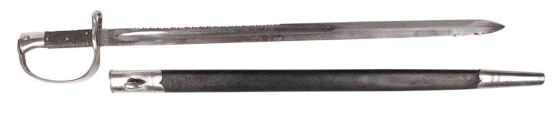 Rare Unauthenticated British Military M1879 Sawtooth Martini-Henry Sword Bayonet (J): A Rare Unauthenticated British Military M1879 Sawtooth Martini-Henry Sword Bayonet in very good condition with a very good scabbard. Markings might indicate colonial production/use. 