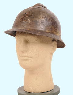 French WWI Model 1915 Adraian Helmet (A): A French WWI Model 1915 Adraian Helmet in good condition with moderate wear to the original finish and some cosmetic blemishes to include denting and holes. The helmet sports a complete liner and web