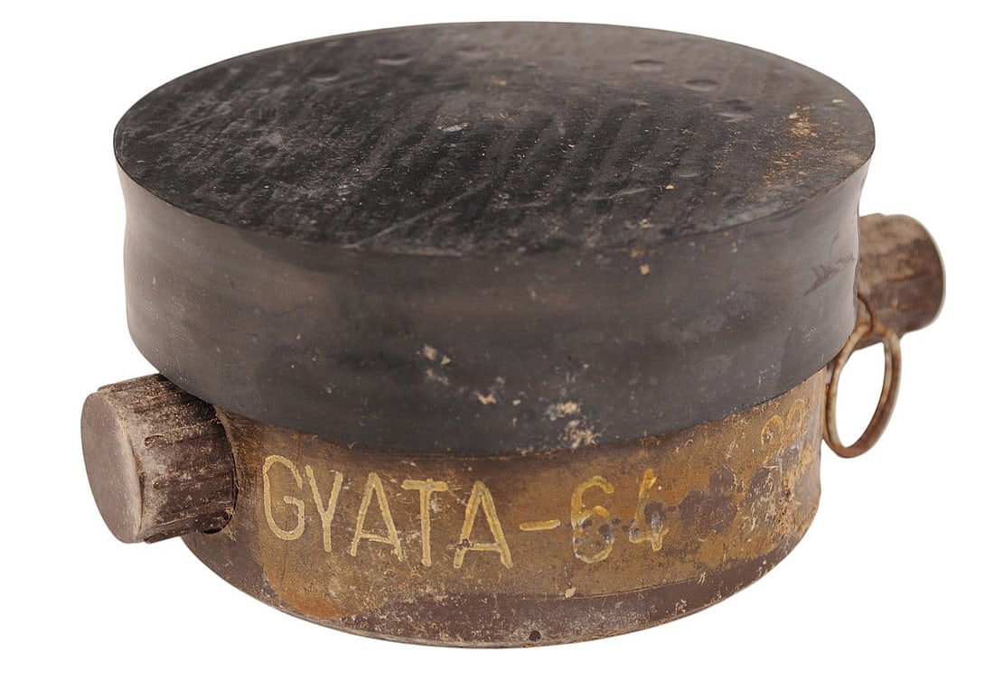 Cold War Hungarian Inert Gyata 64 Bakelite Anti Personnel Mine (CWA): Cold War Hungarian Inert Gyata 64 Bakelite Anti Personnel Mine. Almost identical to the Russian PMN Mine, The Hungarian made copy was much more powerful. Considered one of the deadliest mines of the C