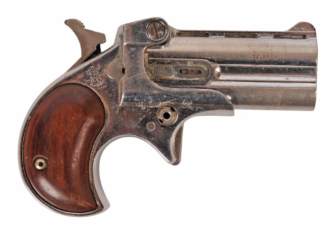 Davis D-32 .32 ACP Derringer Pistol - FFL # 521286 (F3J1): A nickeled Davis D-32 .32 ACP Derringer Pistol in fair condition with a worn finish and a dirty bore. It is missing the barrel retaining lever.