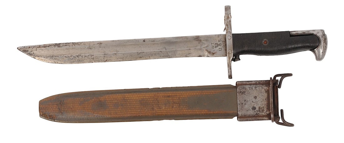 USGI WWII W.F. UFH 1942 Dated M1 Garand Bayonet with Original Scabbard(E2N): An USGI WWII W.F. UFH 1942 Dated M1 Garand Bayonet with Original Scabbard in good condition. The blade has some oxidation and cosmetic blemishing with minimal cracking to the original grip panels. The