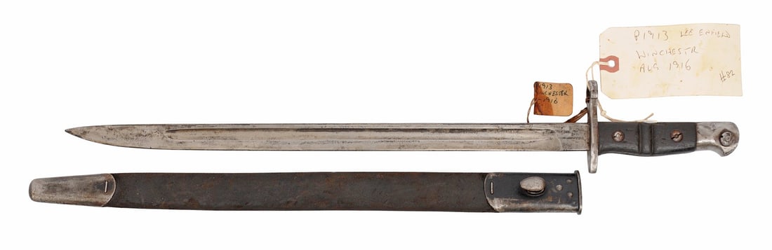 British Military WWI era Winchester Produced Pattern 13/14 Enfield Rifle Bayonet (E2N): A scarce British Military WWI era UA Winchester Produced contract Pattern 13/14 Enfield Rifle Bayonet in good to very good condition with scabbard.