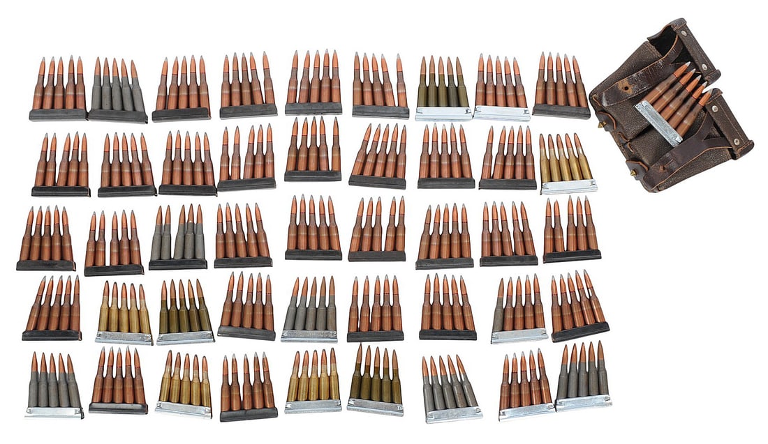 Surplus 7.62x54mmR Lot of 50 Rds. on Stripper Clips with Nagant Rifle Pouch(A2G): A Surplus 7.62x54mmR Lot of 50 Rds. on Stripper Clips with Nagant Rifle Pouch in good to very good condition.
