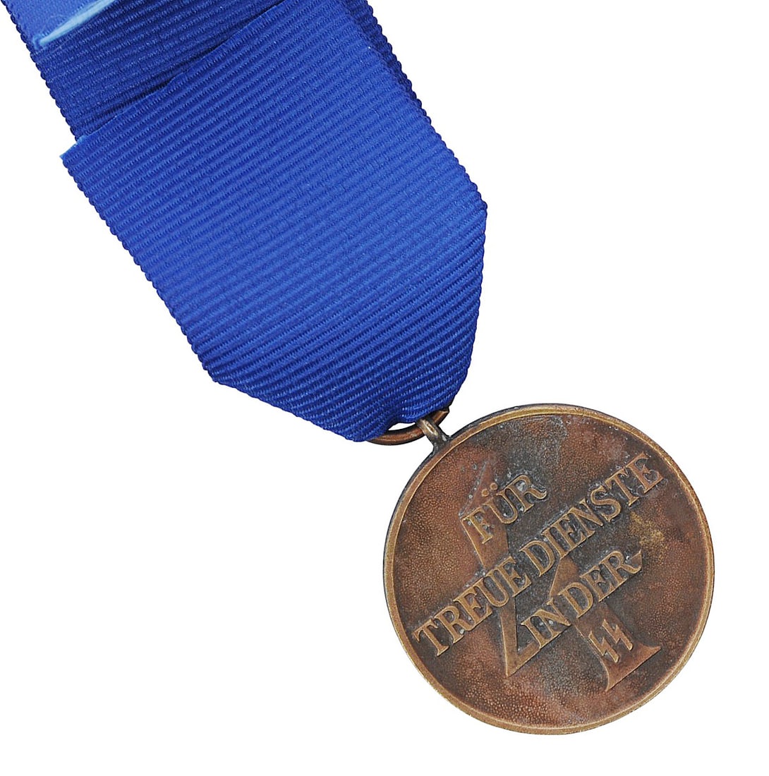 *German WWII era SS Four-Year Service Medal (M2J): A *German SS WWII era Four-Year Service Medal in good to very good condition. *Due to Proxibids/Live auctioneers new payment processor, Payrix, having policy against processing payment for German