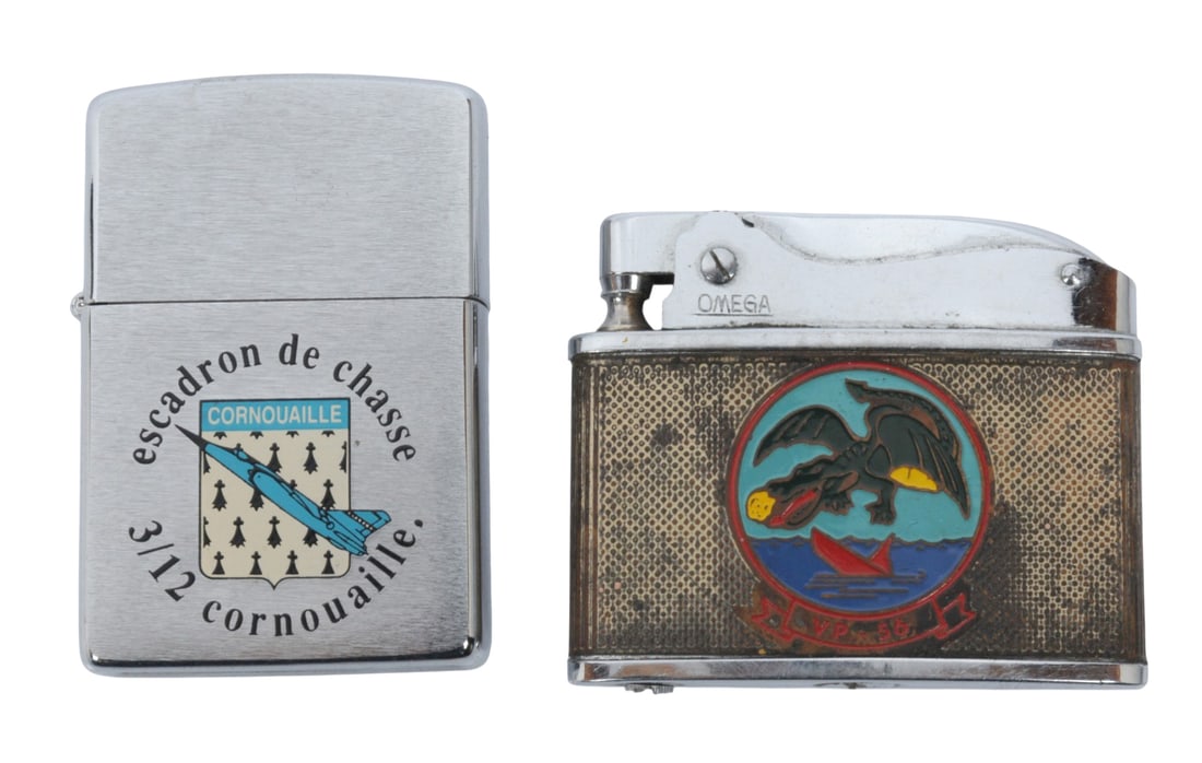 Two Military Aviation Cigarette Lighters (A): The first lighter, a Zippo, is for the 3/12 Cornouaille fighter squadron was a squadron of the French Air Force. Once equipped with Dassault Mirage F1s, the unit regained its designation EC 3/12
