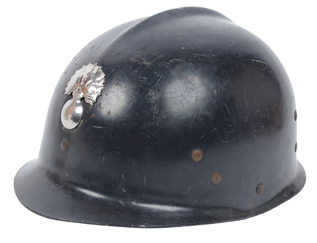 Belgian 1960's Police Helmet with Badge(BM): A Belgian 1960's Police Helmet with Badge in good to very good condition. The helmet maintains good original finish with a nice chin strap and liner. The helmet itself is typically a postwar Belgian