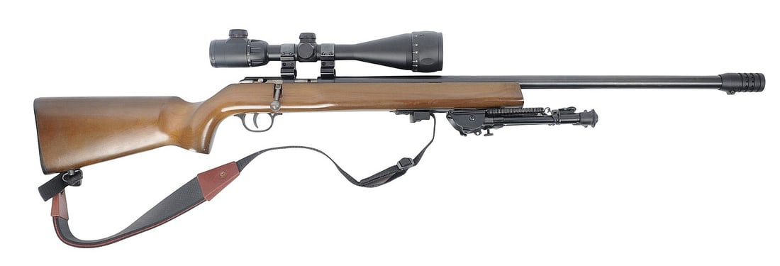 Savage / Anschutz 22LR Bolt Action Rifle with a CP Scope FFL 743114 (JGD1): A Savage / Anschutz 22LR Bolt Action Rifle with a CP Scope in good to very good condition with a bright and defined bore. The action appears to function properly with minor wear to the original finish