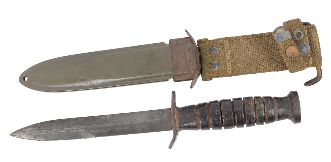 US Army WWII issue M3 Fighting Knife (A1F): A scarce US Army WWII M3 Fighting Knife that is in good condition with signs in usage wear, comes with an M8 scabbard that shows service wear.