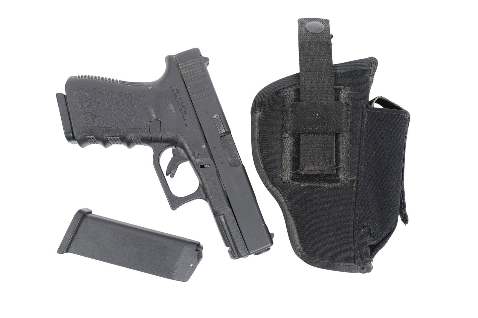 Glock Model 23C Ported 40 S&W Semi Auto Pistol FFL DHE617US (HKR1): A Glock Model 23C Ported 40 S&W Semi Auto Pistol in good condition with a dirty bore. The action appears to function properly with minor wear to the original finish and sports a carry holster with an