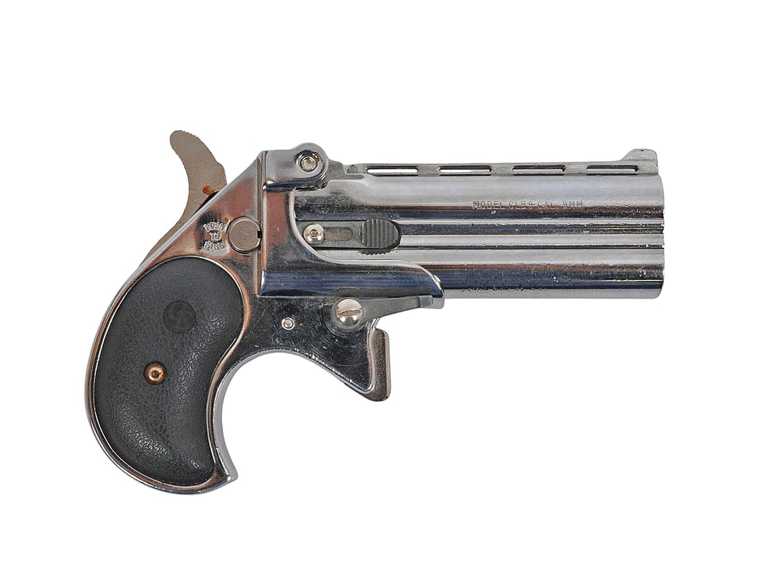 Cobra Enterprises Model CLB9 9mm Break Action Derringer (A1): A Cobra Enterprises Model CLB9 9mm Break Action Derringer in good condition with bright and defined bores. The action appears to function properly with some wear to the original nickel finish.