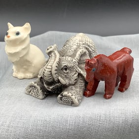 Miniature porcelain cat, carved stone horse and resin elephant