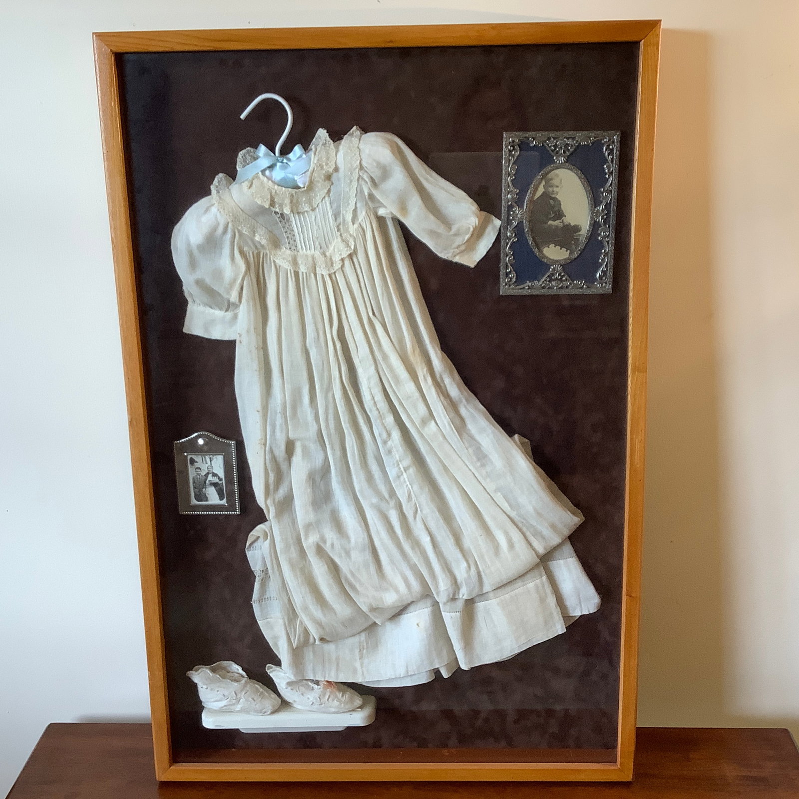 Shadowbox with 1920 Christening Outfit, Shoes, Framed Photographs: Obituary taped on reverse