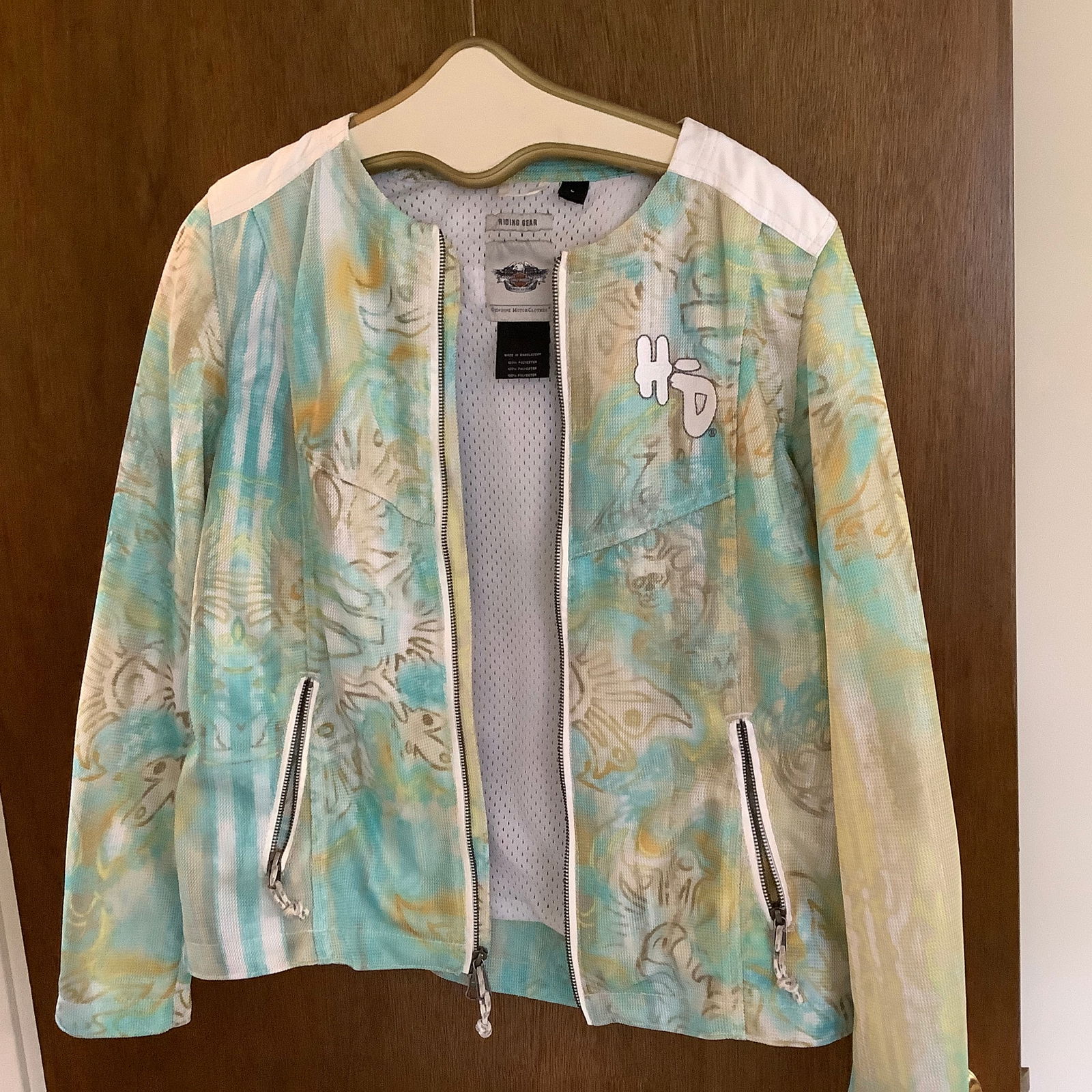 Genuine Harley Davidson Ladies Riding Jacket: White, yellow, turquoise and taupe Size L HD on front, Embroidery design upper center back Ventilated for spring/summer rides