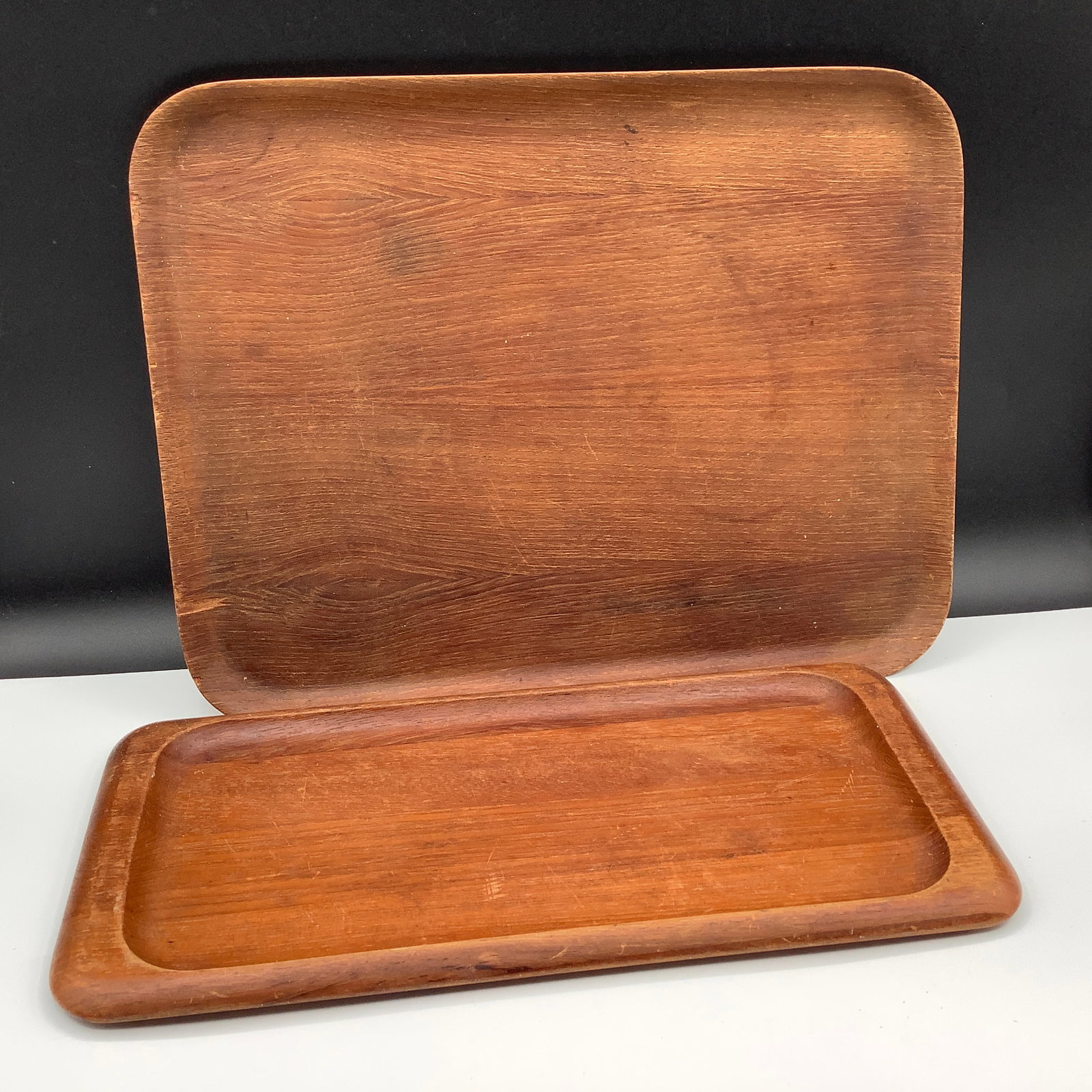 MCM Teak Trays - One made in Sweden by Åry Nybro Fanérprodukter & Digsmed in Denmark: Åry Nybro Fanérprodukter Teak Tray Smaller tray is made in Denmark by Digsmed,c 1964 Vintage and has some scratches from use