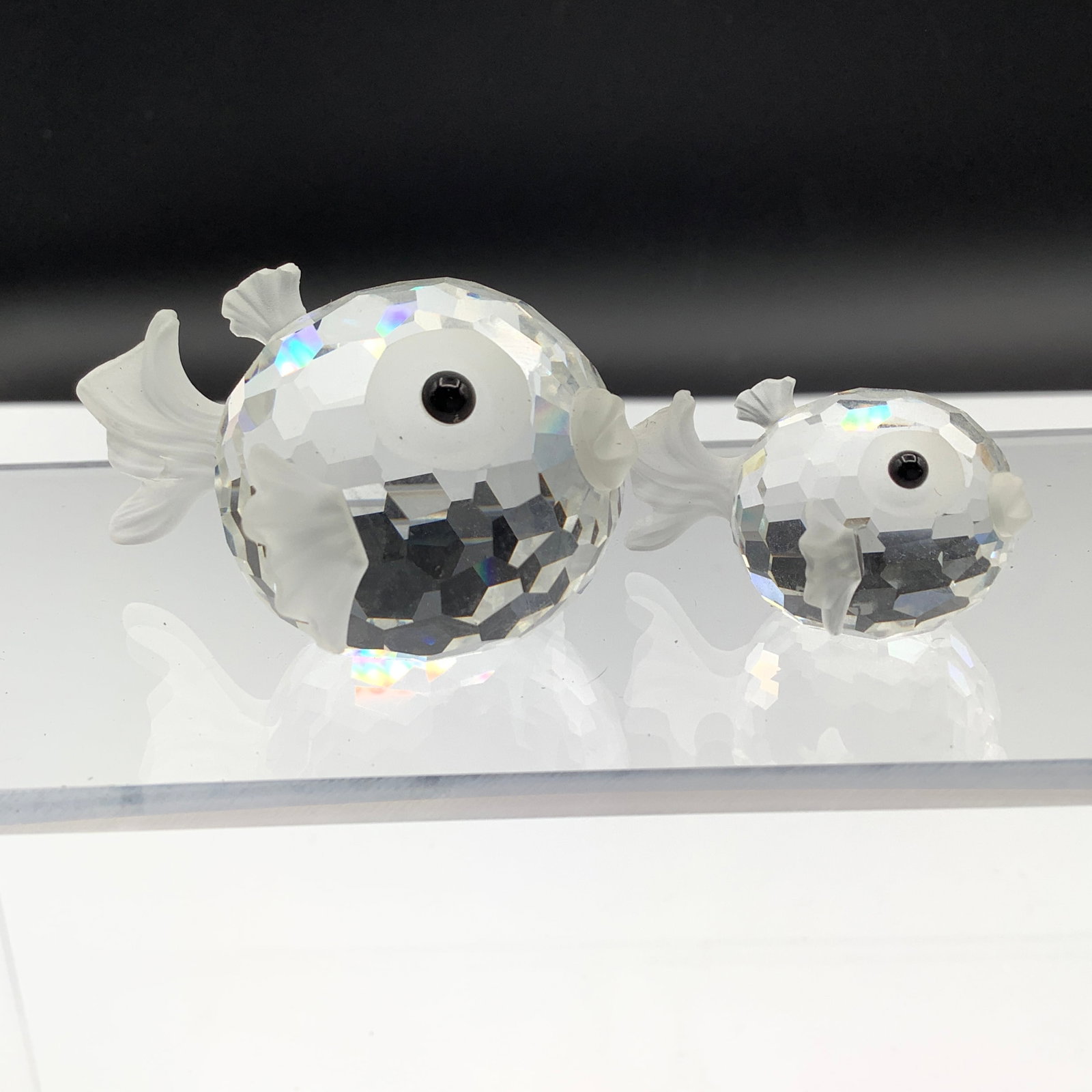 Pair of Swarovski Crystal Puffer Fish with Old Block Logo and Black Eyes: Both blowfish have the old Swarovski block logo Ca 1980s Larger fish is 2 inches long, smaller fish is just under 1.5 inches long