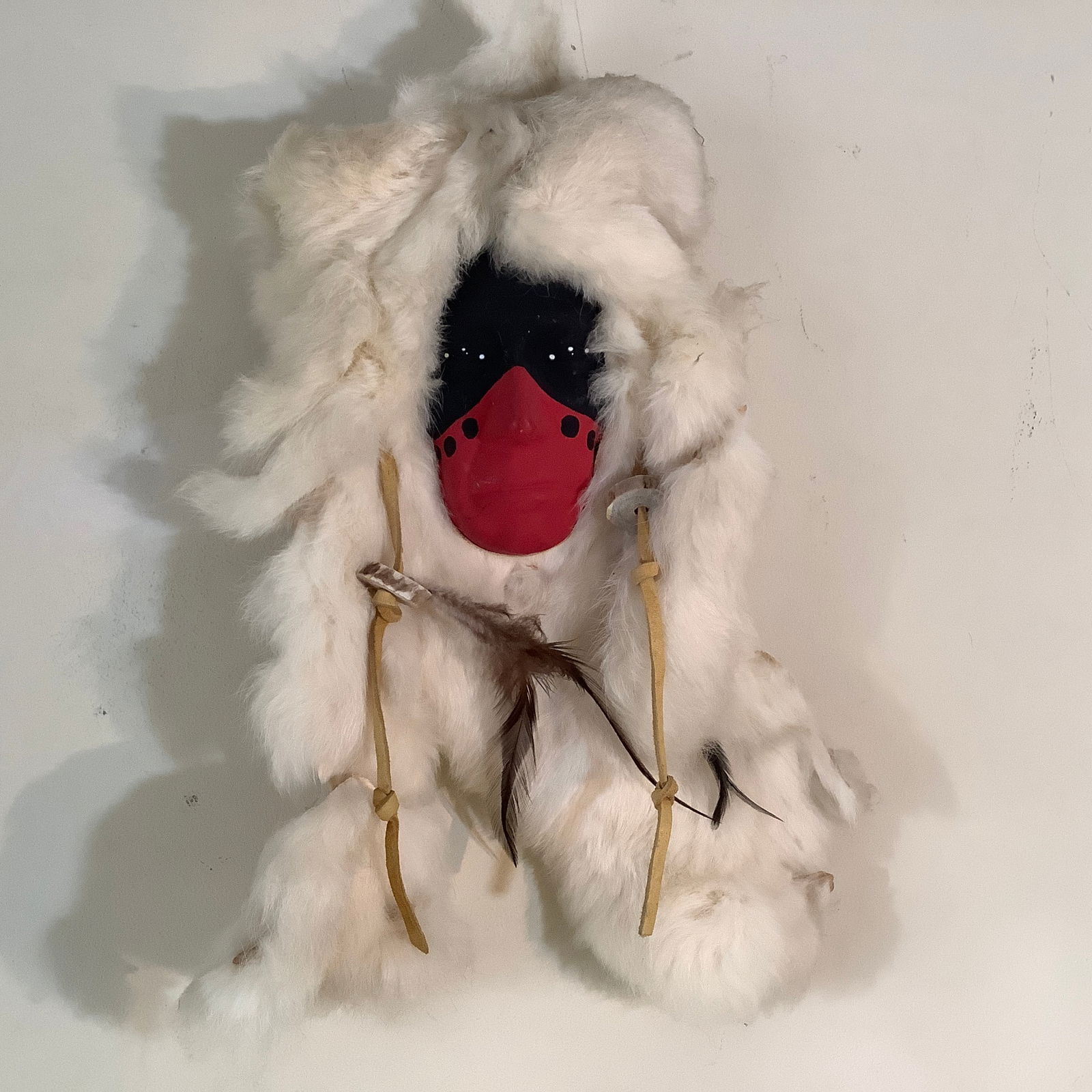 Vintage Alaskan Native American Face with Rabbit Fur and Leather/Feathers: Art mounted on wood backing with hang strap Face painted red and black with white accents