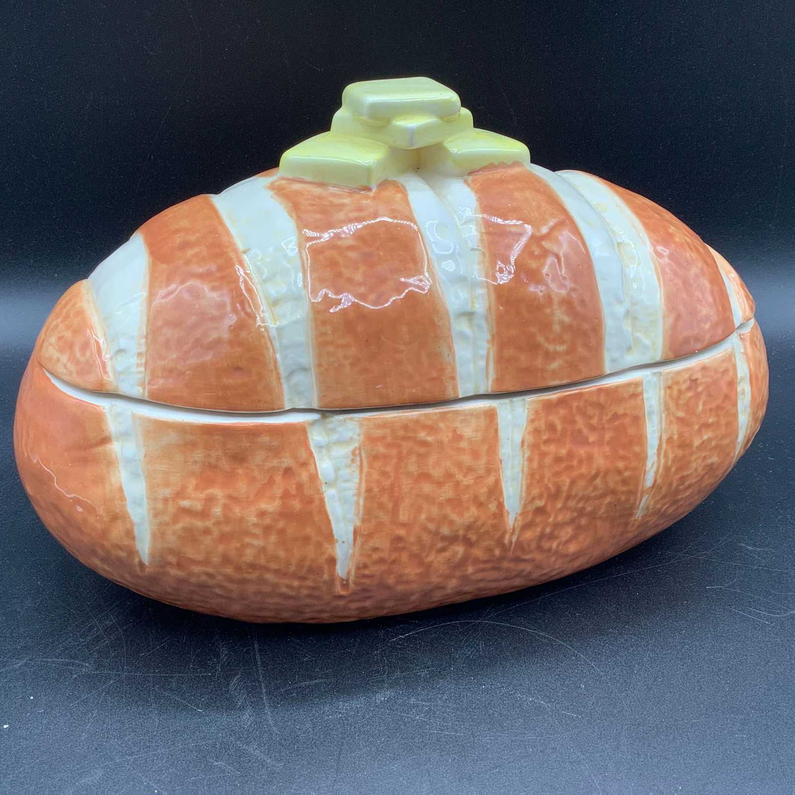 Ceramic Loaf of Bread Cookie Jar by The Pottery In Hawaii: Shape of a bread loaf with butter pats handle