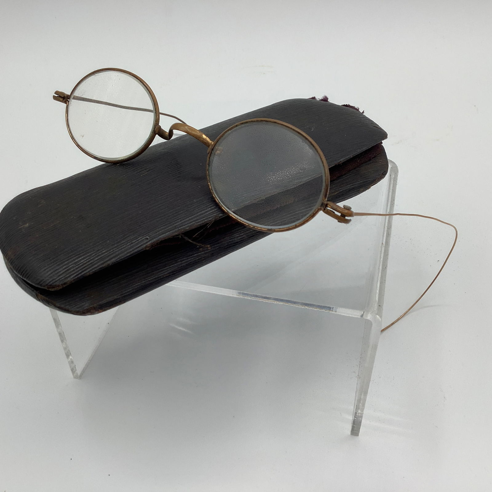 Antique Brass Spectacles With Case: Bent hook arms One arm has been replaced Case has torn fabric on one end