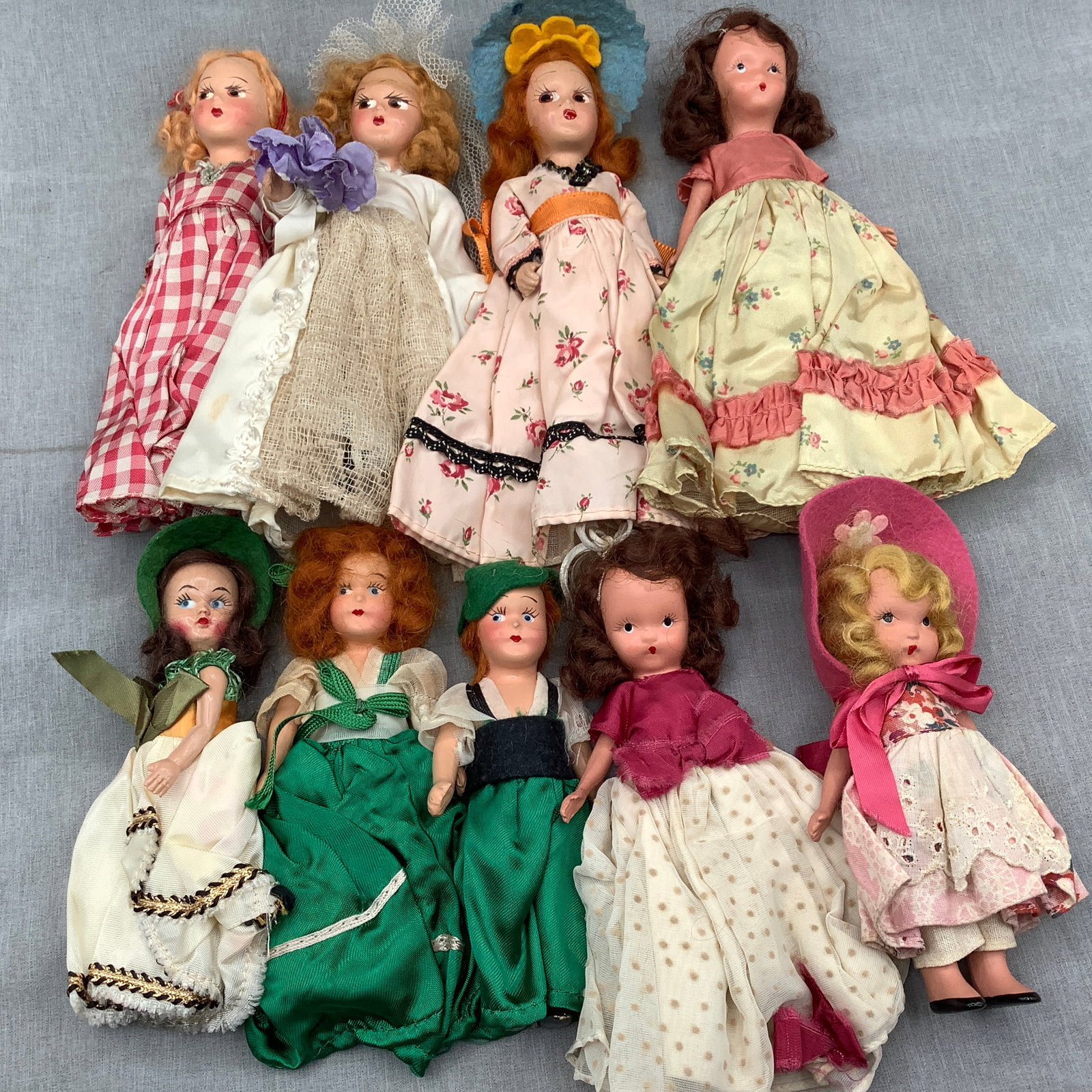 9 Vintage Nancy Ann Story Book Dolls: Dolls all have fixed open eyes and varous outfits