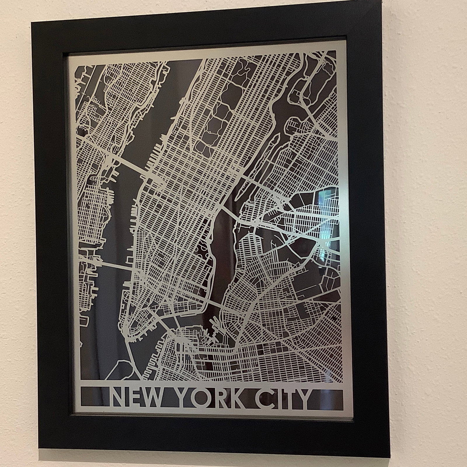 Laser Cut Stainless Steel Metal Map of NYC: Laser-cut metal overlay on top of black 12x16