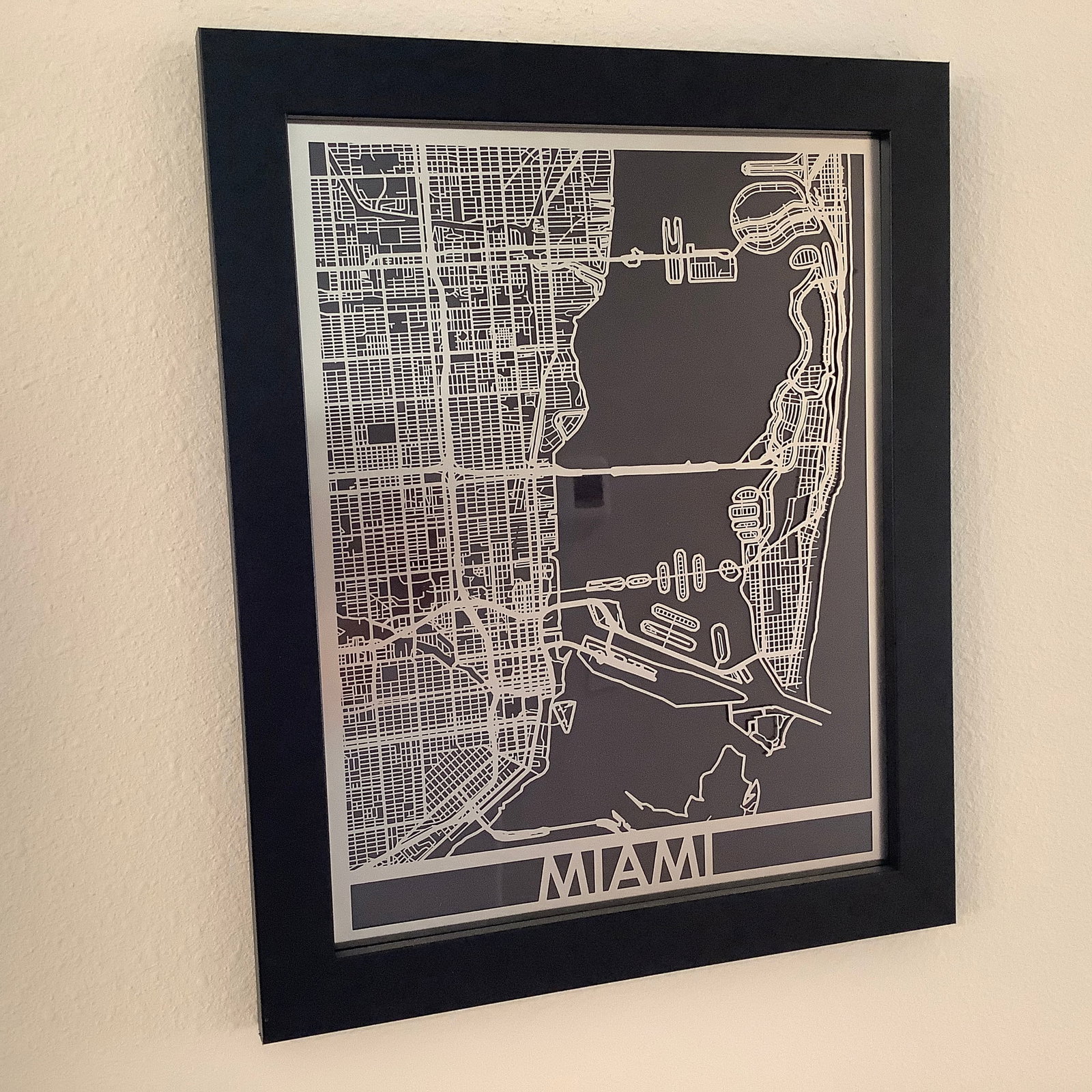 Laser Cut Stainless Steel Metal Map of Miami: Laser-cut metal overlay on top of black 12x16