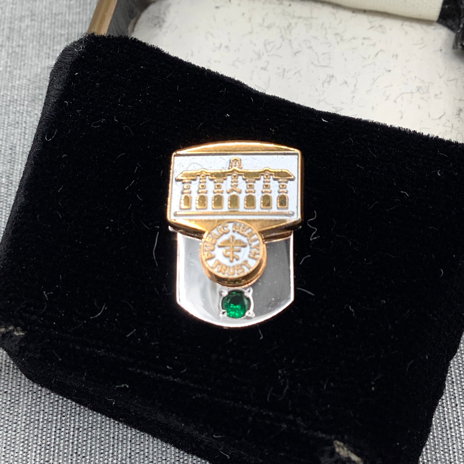 Public Health Trust Service Pin, 10KD with Pin Box: Public Health Trust is composed of volunteers who provide leadership for joint planning between Jackson Health System, Univ of Miami School of Medicine and Miami-Dade county This is a symbolic pin for