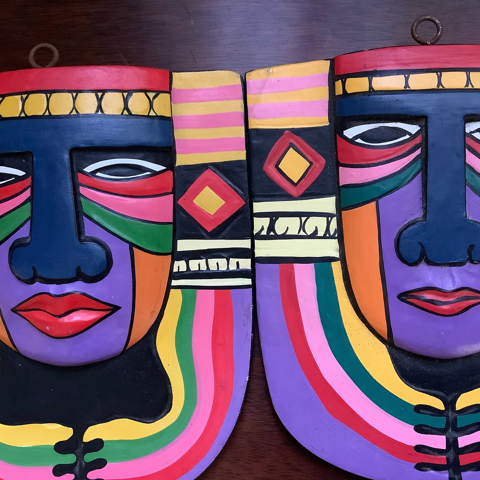 Pair of Indonesian Hand Carved Brightly Painted Plaques: Plaques are carved by the men and women in the Gianyar district in Bali. The children after school finish the works with bright colored paint Commercial timber is used, not tropical rain forest wood E