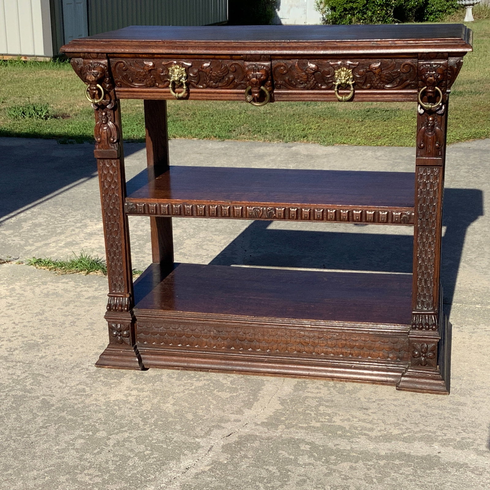 Early 1900s R.J. Horner Carved Lion, Pheasant and Monk Sideboard: Intricate details with a few brass accents Attb to R.J. Horner, no paper label but has the attributes Drawers have angled fronts and operate smoothly High relief carvings of lions heads, paws, pheasan