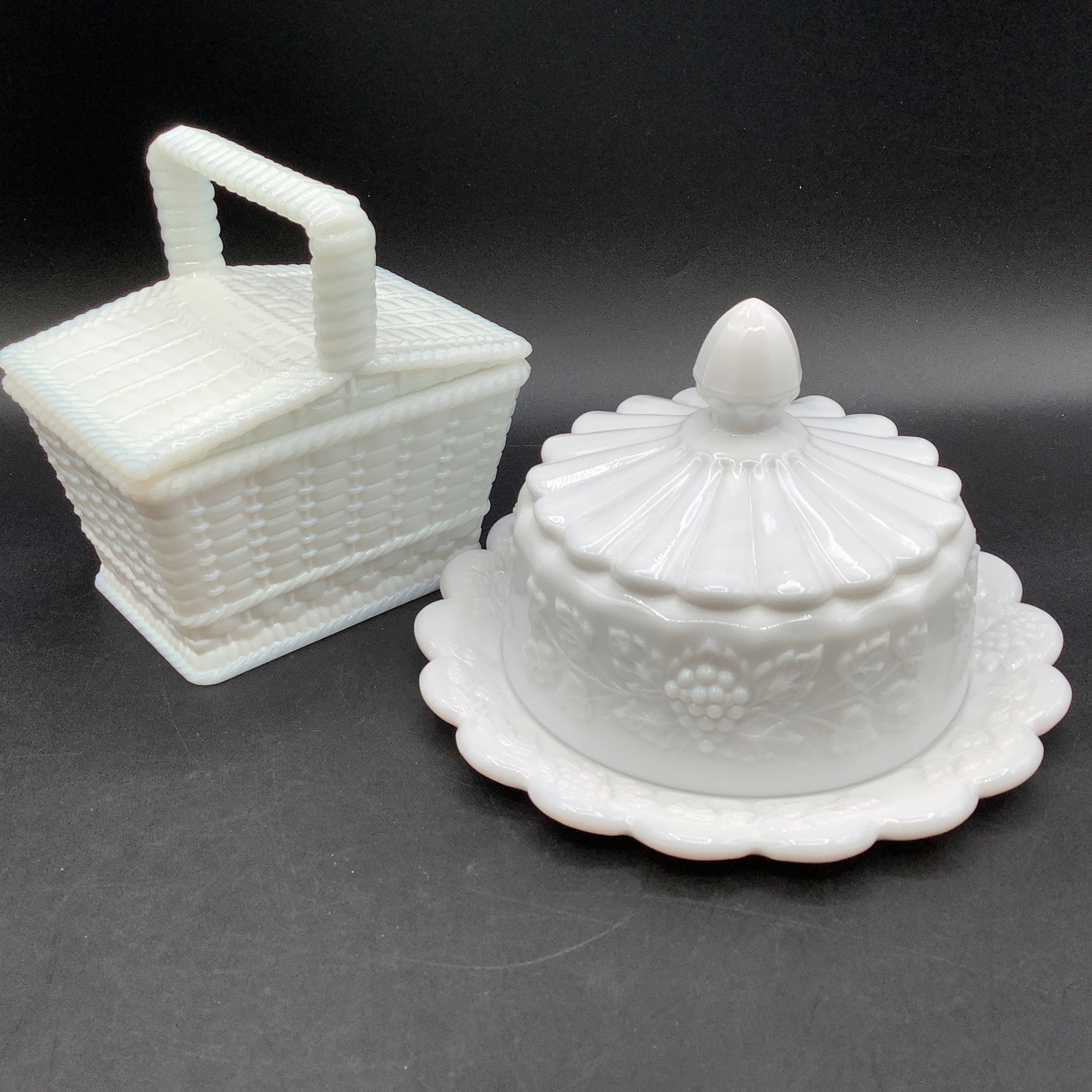 2 Westmoreland Labeled Milk Glass Butter Dish and Sugar Dish: Sugar Dish is shaped like a basket with basketweave design Round butter dish with grapevines All with Westmoreland mark