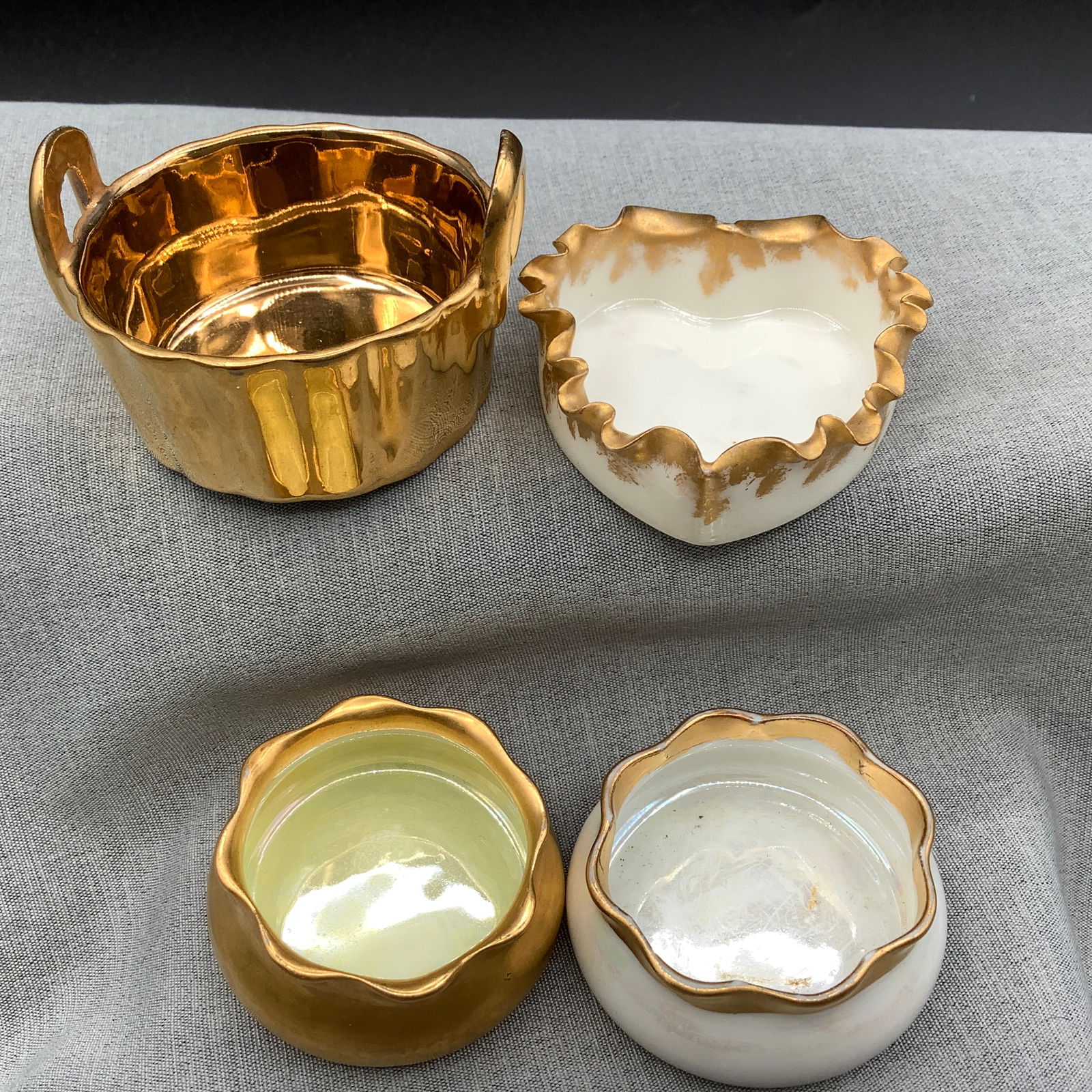 4 Gold Porcelain Open Salts or Salt Cellars: Iridescent porcelain with gold scalloped rim, made in Germany Gold O & EG Royal Austria Salt ca 1899-1918. Oscar and Edgar Gutherz of Altrohlau, Bohemia Gold EB Merrill open salt with handles Heart sh