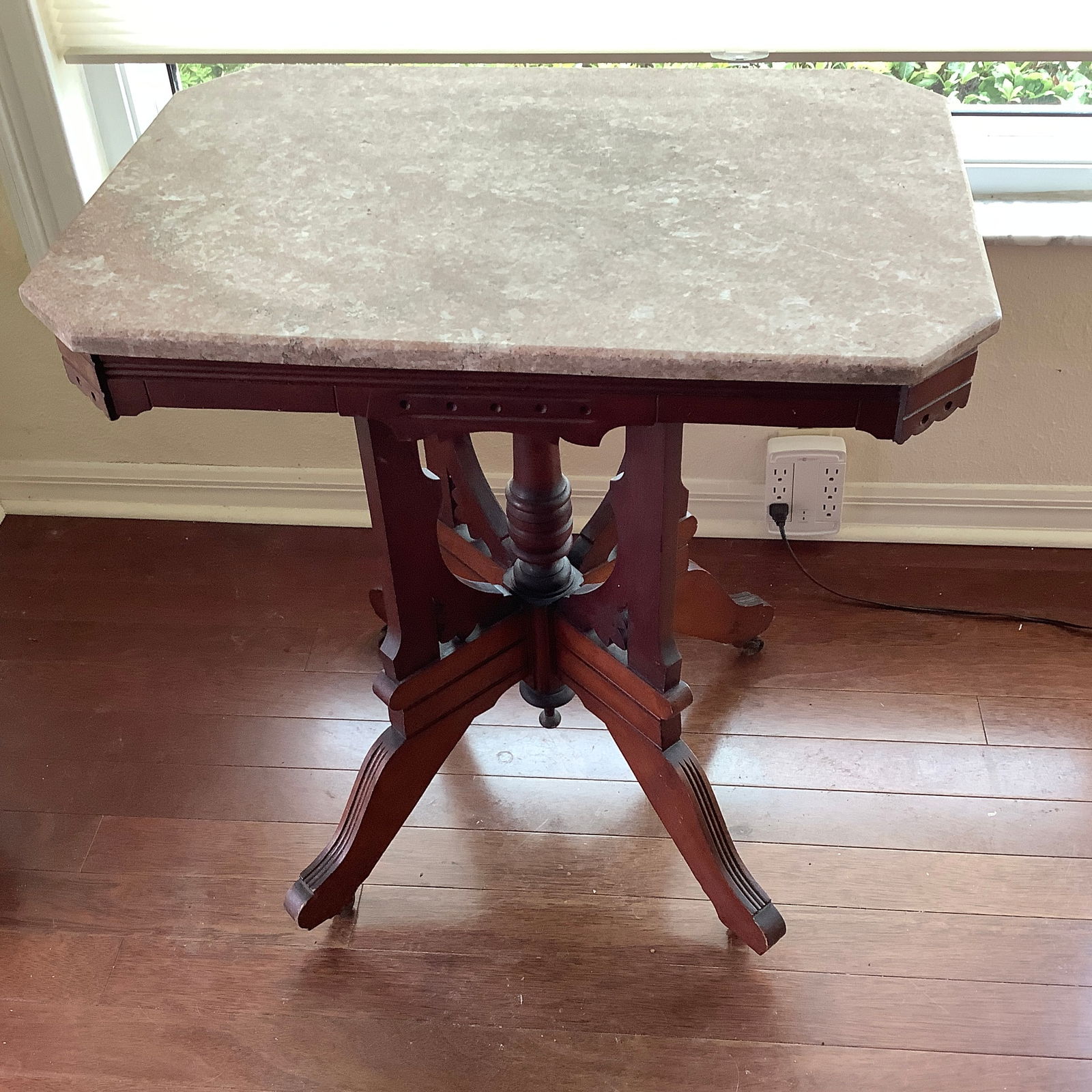 Antique Eastlake Victorian Marble Top Mahogany Table: Eastlake Victorian Mahogany Incised lines on legs that sit on casters Light colored marble top