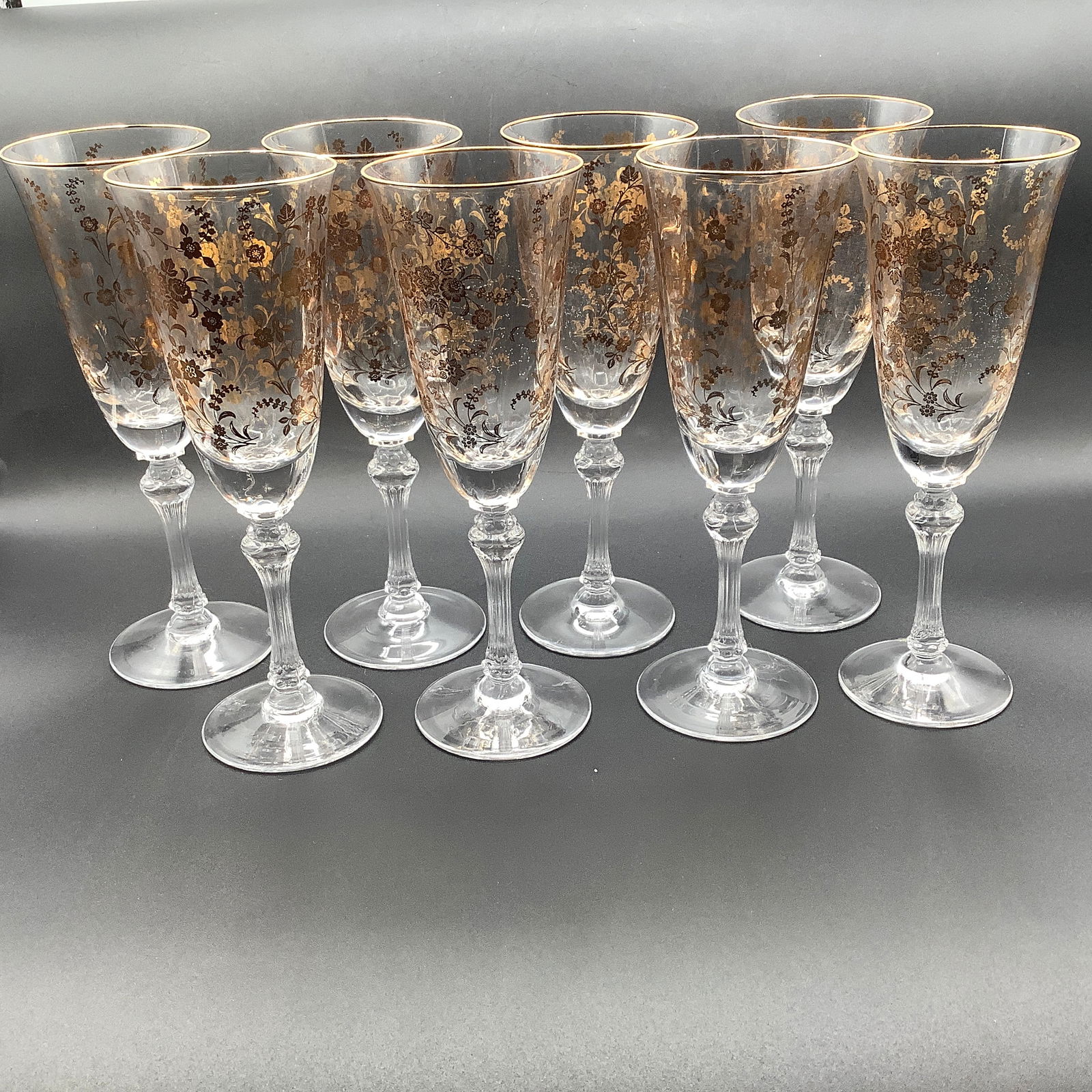 Set of 8 Tiffin Signed Champagne Glasses with Gold Etched Flowers: Fluted stems, etched Tiffin on underside Gold rim and gold flowers