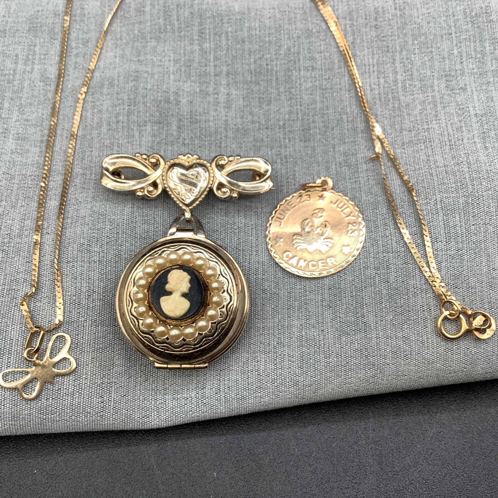 14 Kt Gold Herringbone Necklace with Butterfly Charm, Cancer Charm and Cameo Locket Brooch (1 of 12)