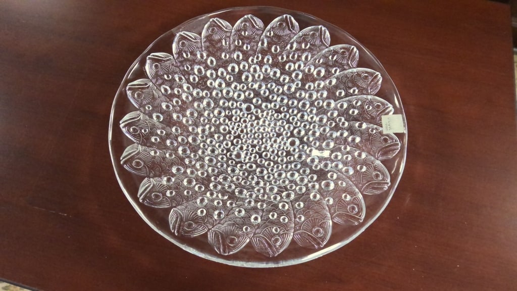 Lalique Roscoff Crystal Bowl Lalique Roscoff clear crystal fish and bubbles bowl originally designed: Lalique Roscoff clear crystal fish and bubbles bowl originally designed by Rene Lalique in 1932, the Roscoff bowl is named after a beautiful fishing port in Bretagne, France. Water droplets adorn the 