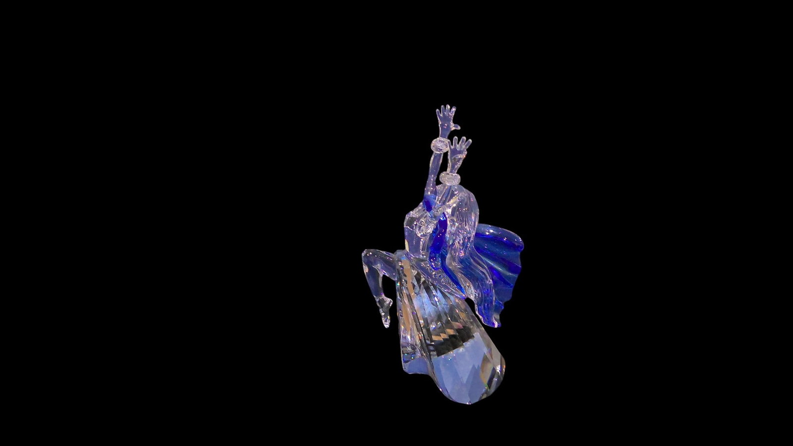 Swarovski Crystal Figurine Isadora: Limited edition Swarovski Collectors Society piece. First of the trilogy series, features majestic dancer named after Isadora Duncan, the mother of modern dance. She wears a blue crystal scarf and inc