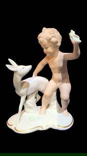 Vintage Wallendorf Putto Porcelain Figurine: Wallendorf "Putto" porcelain figurine of a boy with a faun. Designed by Kurt Steiner in the 1920's and produced by Wallendorf in the 1960's. Marked 1347 on bottom. In good condition but there are blem