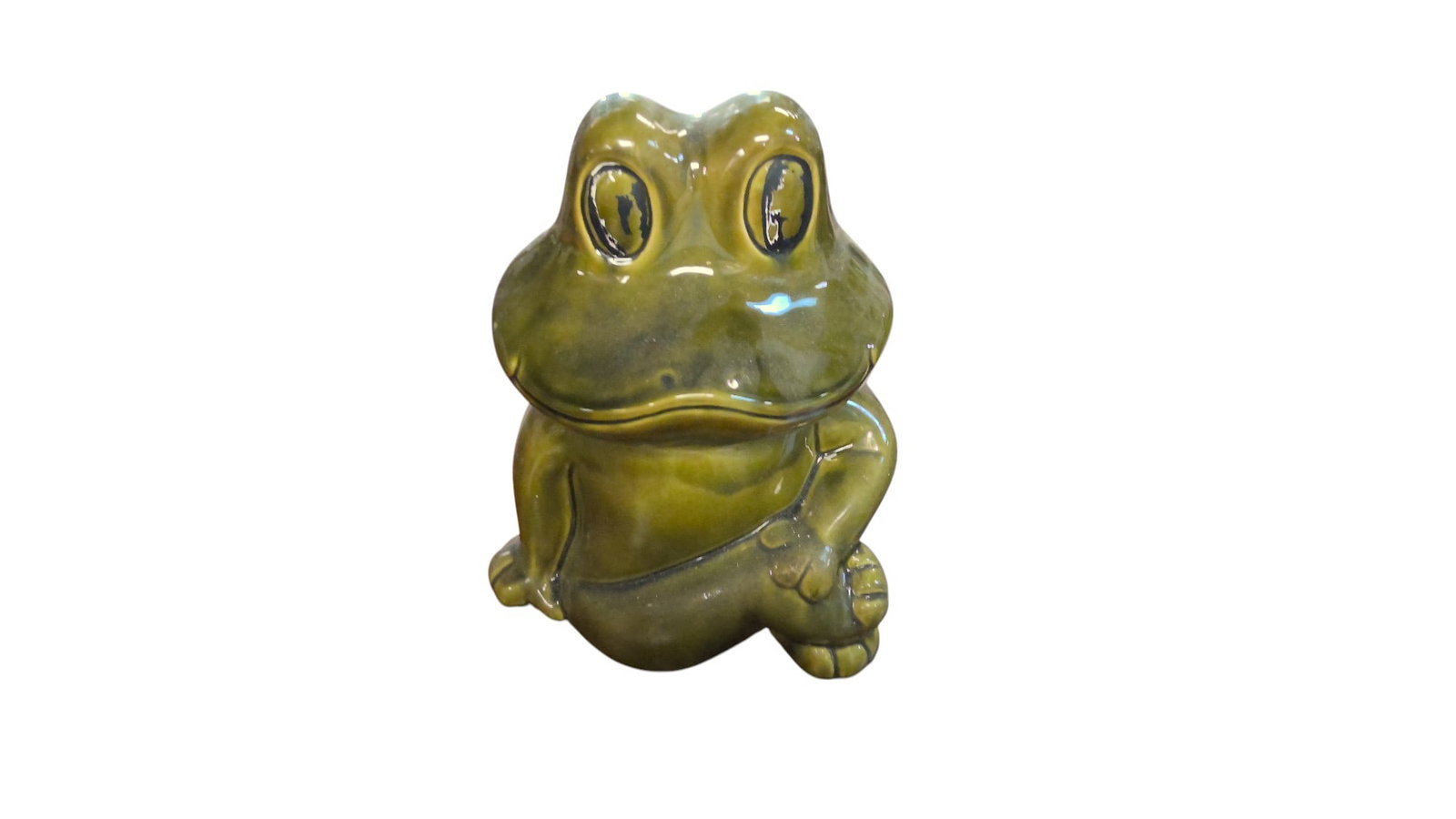 Neil the Frog cookie jar: This vintage Neil the Frog cookie jar from 1974 by Sears is a large ceramic and porcelain canister with a capacity of 3 quarts. It features a head cover lid and a solid green color. Made in the United