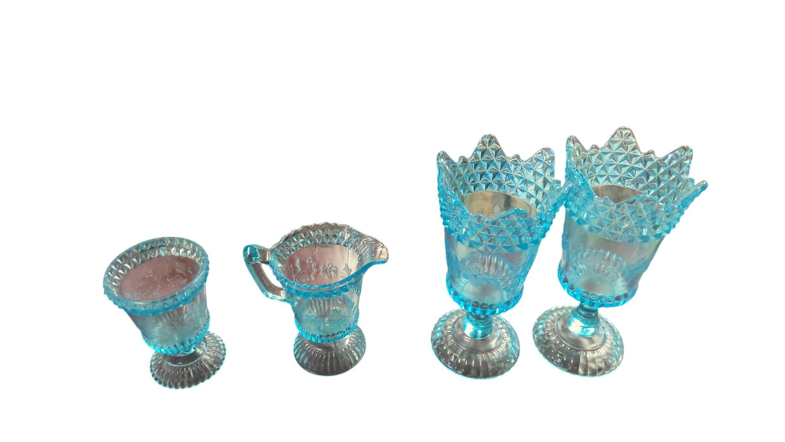 EAPG "Wildflower Blue" set: EAPG Adams & Company "Wildflower Blue" 4 piece set. Set includes creamer, one open spooner, and 2 celery vases. size: creamer-5.5"H x 5.25"W Open spooner-5"H x 3.5"W