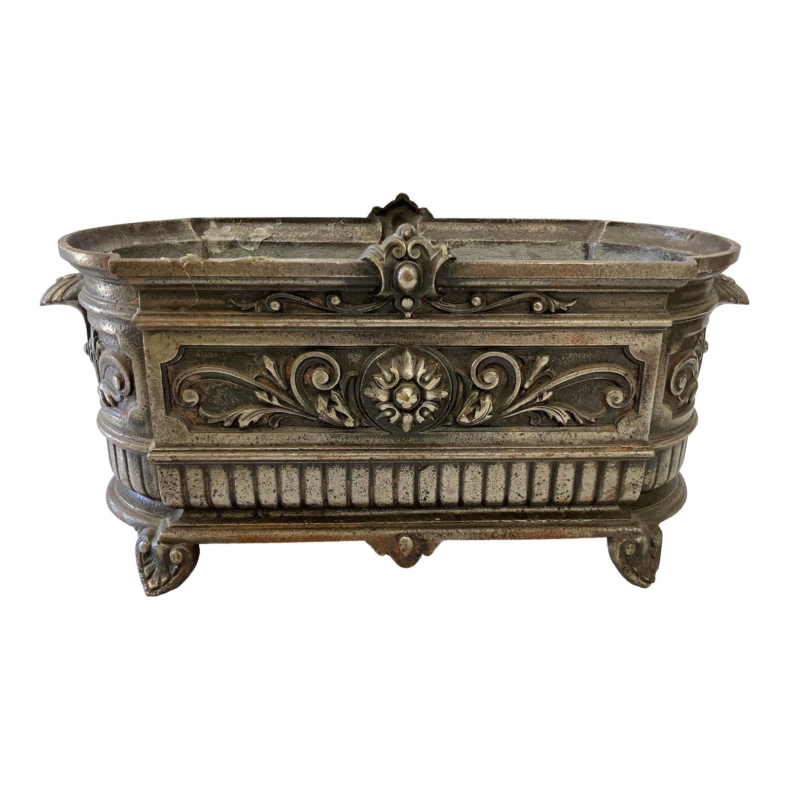 French Metal Zinc Style Cachepot: 18"W × 8"D × 8"H 1960s zinc style metal cachepot. Nice ornate details and can hold several orchids. Add some French chic style to your home. Made in France.