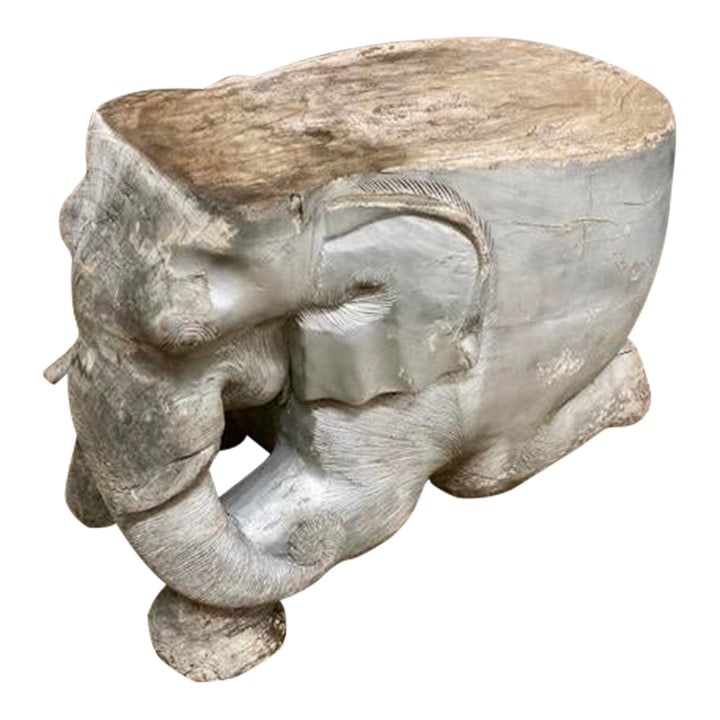Carved Wood Elephant Cocktail Table/Seat Right Trunk: 24"W × 12"D × 17"H 2000s Boho Chic carved wood elephant cocktail table/seat. This elephant shows trunk swinging to the right side, and we have two available in this auction. Also in this auction, we