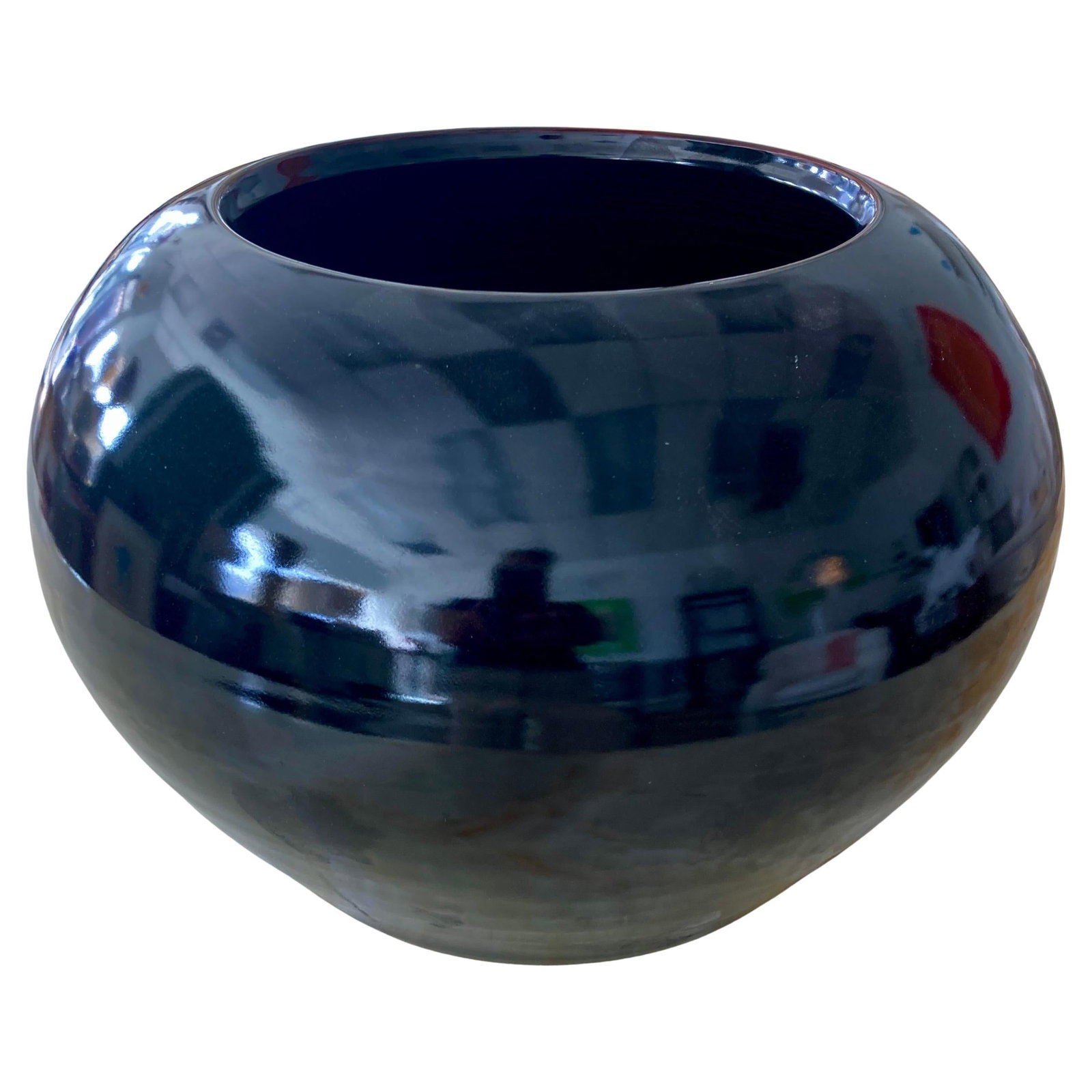 Black Reflective Glaze Ceramic Cachepot: 14"W × 14"D × 10"H 1980s large orchid pot in reflective black glazed ceramic. This cachepot can easily hold 2 or 3 orchids. Nice modern form in this handmade pot. Made in U.S.A.