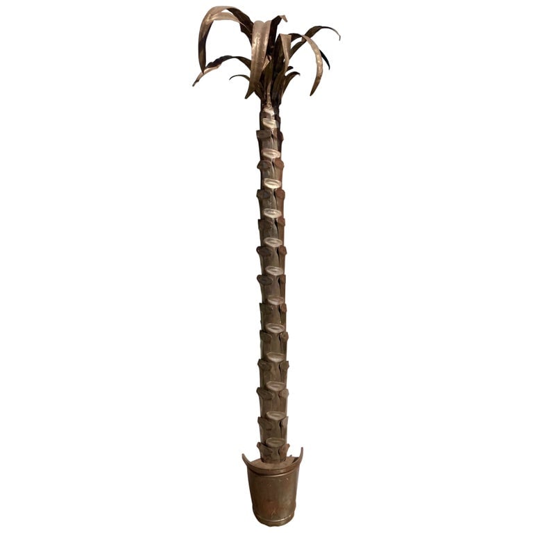 Jansen Style Metal Wall Mount Palm Tree Original Condition: 25"W × 19"D × 97"H 1950s Jansen style metal life size wall mount palm tree. This is in all original condition. Some rust to metal finish and base is loose to the the palm. However when mounted to wa