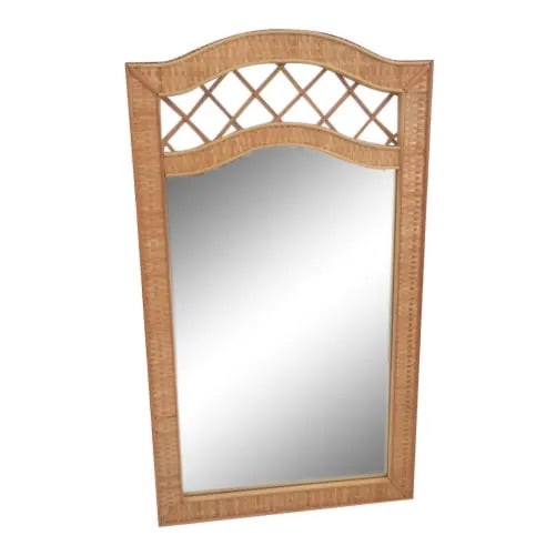 Palm Beach Rattan Wall Mirror: 27"W × 1"D × 47"H 1980s Palm Beach rattan wall mirror with braided rattan edge. A beautiful wall accent! Made in U.S.A.