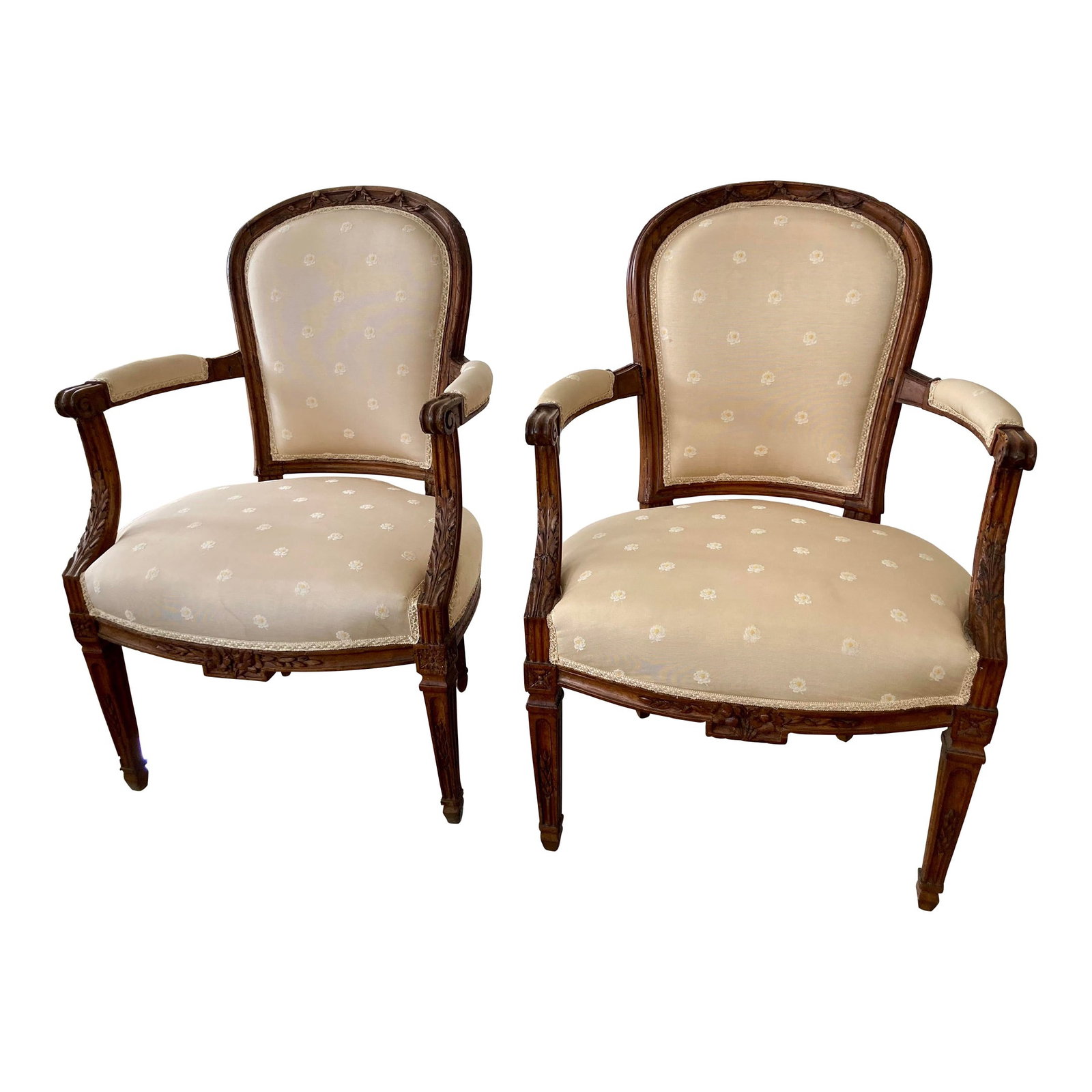 French Hand Carved Fauteuil Chairs, a Pair: 24"W × 22"D × 35"H Seat Height:17.0 in Arm Height: 24.0 in Mid 18th Century French fauteuils all hand carved and constructed with wood dowel joinery. The details of the hand carvings are incredible.