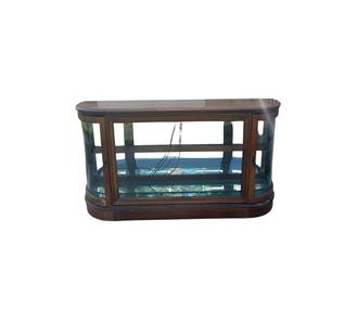 Low Curved Glass Curio Cabinet with Light and Glass Shelves: Solid glass and wood curved low curio cabinet. There are shelves and a light inside. There is some damage on the lower left as shown in the pictures and reflected in the price.