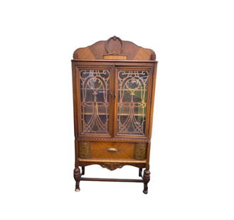 Vintage Antique China Cabinet: Scroll wood glass front china cabinet made from solid wood. 3 shelves and one drawer. There is a mark from moving on the left lower drawer and a chip out of one of the feet but we have the wood piece