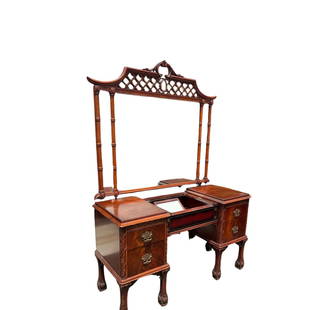 Chippendale Style Vanity Desk: Intricately carved solid mahogany Chippendale style writing desk or could be used as a vanity. Paw foot with flame wood. There are 4 drawers and in the center you can slide open another compartment th