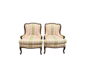 Set of Ethan Allen Louis XV-Style Bergere Chairs: Elegant vintage set of Ethan Allen armchairs in a French inspired design with traditional striped upholstery. Hand carved solid wood frames. Generously cushioned seats providing exceptional comfort. F